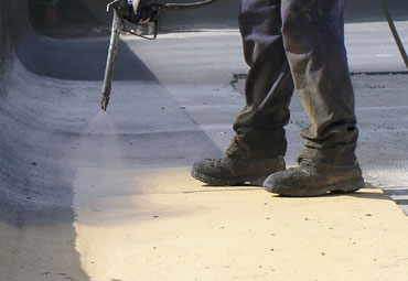Coating systems over Norfolk spray foam roof systems